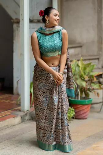 Taupe silk blend geometric print golden zari border saree