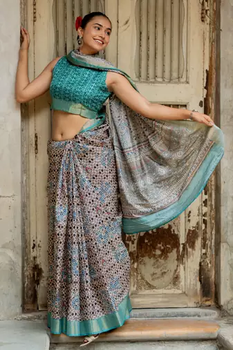 Taupe silk blend geometric print golden zari border saree