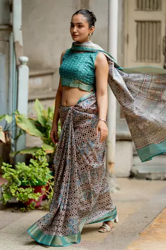 Taupe silk blend geometric print golden zari border saree
