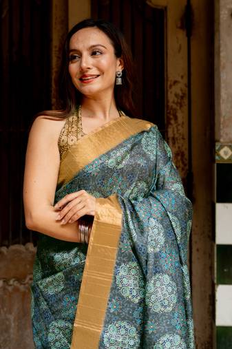 Grey silk blend ajrakh print golden zari border saree