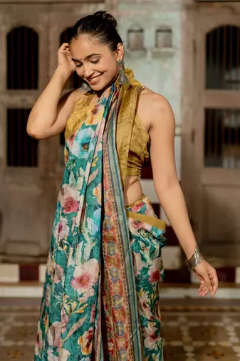 Teal silk blend floral print golden zari border saree