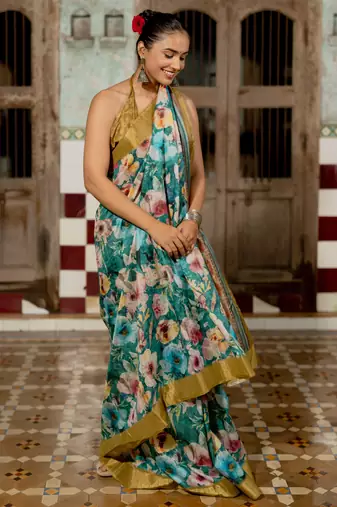 Teal silk blend floral print golden zari border saree