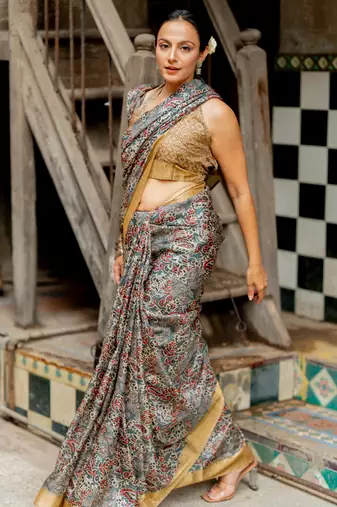 Greyish blue silk blend floral print golden zari border saree