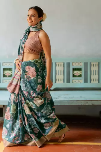 Rama green silk blend floral print golden zari border saree