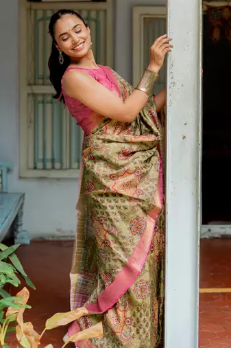 Light olive green silk blend ajrakh print floral print golden zari border saree