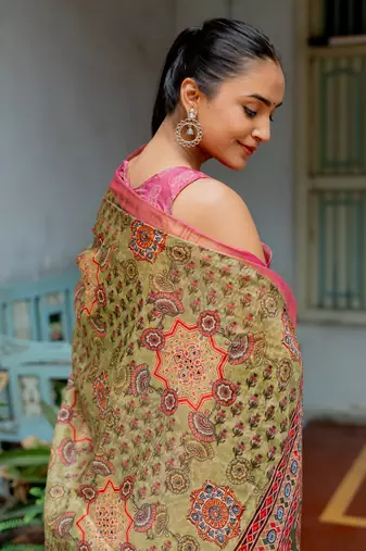 Light olive green silk blend ajrakh print floral print golden zari border saree