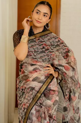 Cream kota doria polyester geometric print golden zari border saree