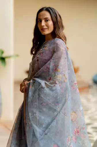 Greyish blue organza floral print golden gota work golden border saree