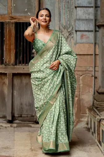 Dusty green silk blend geometric print golden woven border saree