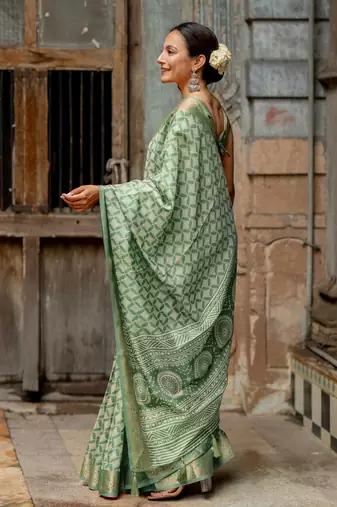Dusty green silk blend geometric print golden woven border saree