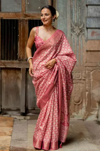 Coral pink silk blend geometric print golden woven border saree