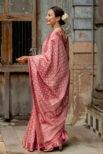 Coral pink silk blend geometric print golden woven border saree