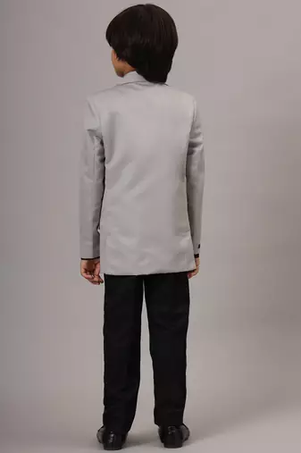 Light grey blazer with black trousers