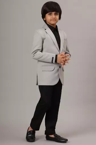 Light grey blazer with black trousers