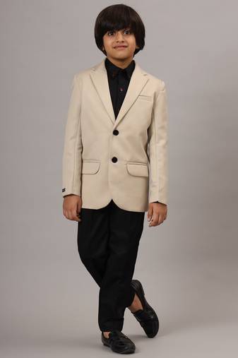 Beige blazer with black trousers