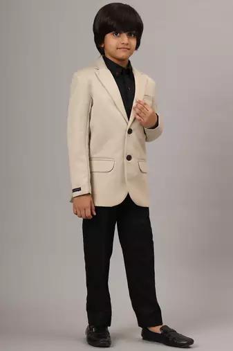 Beige blazer with black trousers