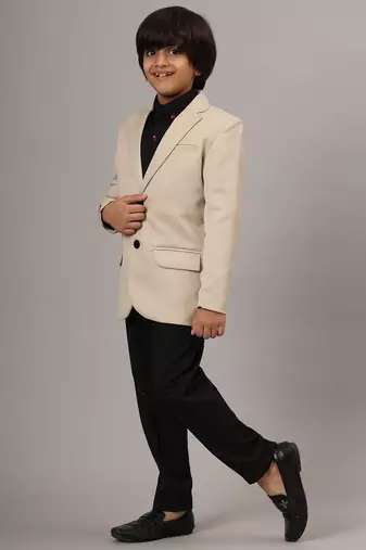 Beige blazer with black trousers