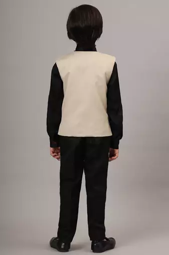 Beige waistcoat with black shirt and black pant