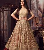 Beige embroidered net semi stitched anarkali lehenga suit.