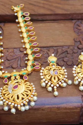 Designer matte finish ruby peacock pendant long necklace set