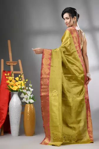 Sap green floral motifs tissue silk saree with zari borders