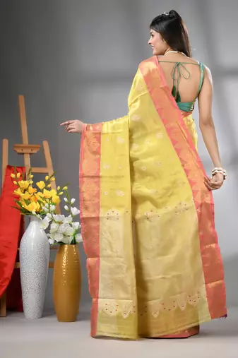 Yellow floral motifs tissue silk saree with zari borders