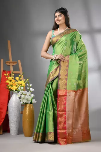 Green floral motifs tissue silk saree with zari borders