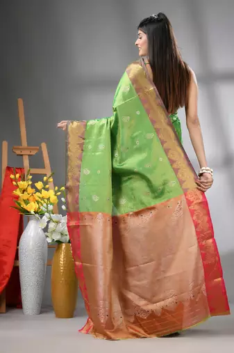 Green floral motifs tissue silk saree with zari borders