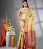 Beige floral motifs tissue silk saree with zari borders