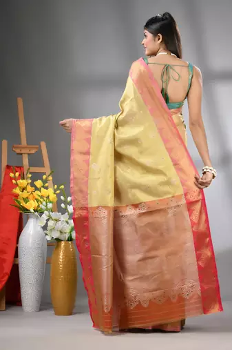 Beige floral motifs tissue silk saree with zari borders