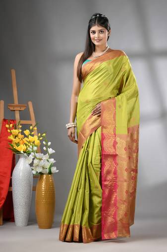 Light green texture motifs tissue silk saree with zari borders