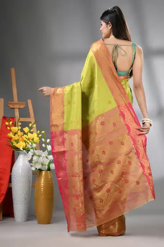 Light green texture motifs tissue silk saree with zari borders
