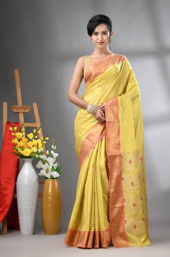 Yellow texture motifs tissue silk saree with zari borders