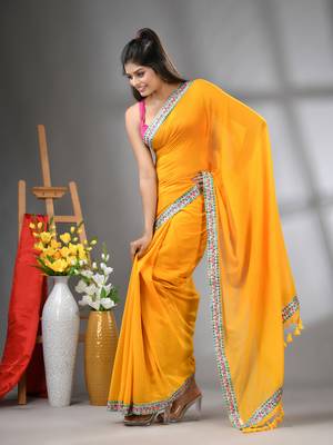 Yellow mul cotton soft saree with embroidered borders 2