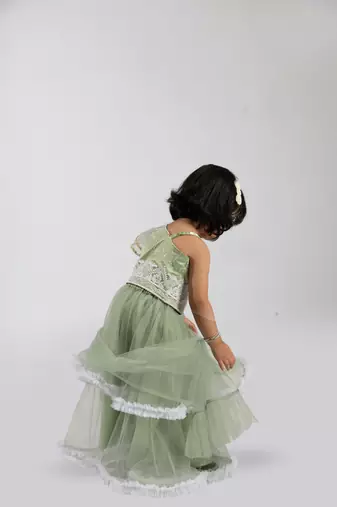 Elaisha girls  embroidered top & ruffled edges layered net skirt set - green