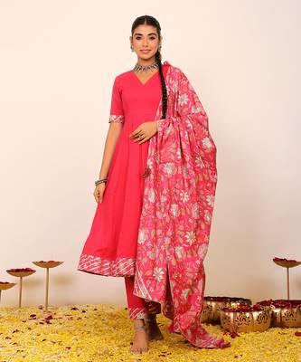 Rani pink solid anarkali suit set paired with pant and printed dupatta 1