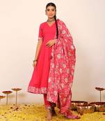 Rani pink solid anarkali suit set paired with pant and printed dupatta