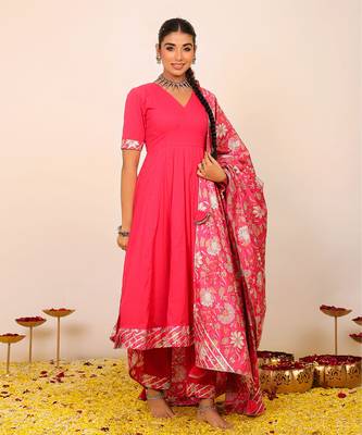 Rani pink solid anarkali suit set paired with pant and printed dupatta 3