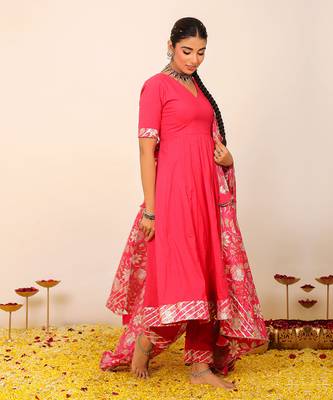 Rani pink solid anarkali suit set paired with pant and printed dupatta 4