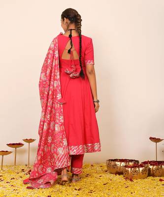 Rani pink solid anarkali suit set paired with pant and printed dupatta 6