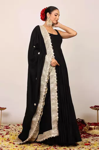 Black solid anarkali kurta set paired with dupatta having gota work at border
