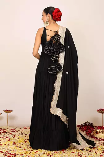 Black solid anarkali kurta set paired with dupatta having gota work at border