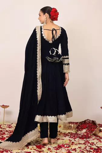 Solid black velvet anarkali kurta paired with pant and dupatta