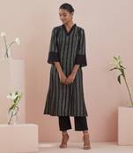 A line kurta in textured cotton with solid black pants