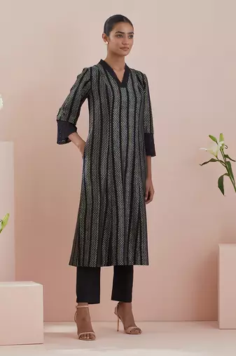 A line kurta in textured cotton with solid black pants