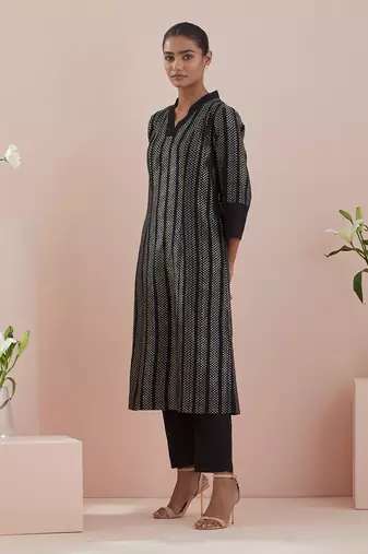 A line kurta in textured cotton with solid black pants