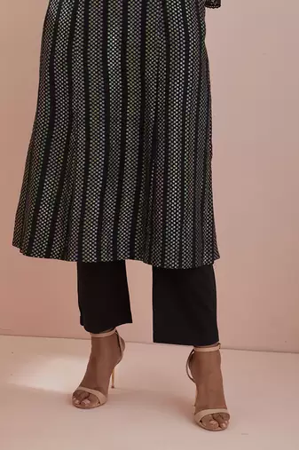 A line kurta in textured cotton with solid black pants