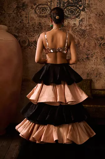 Rose gold embroidered blouse with black and rose gold layerd skirt  with dupatta