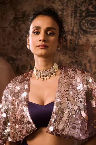 Lilac embroidered cape with purple skirt and bustier
