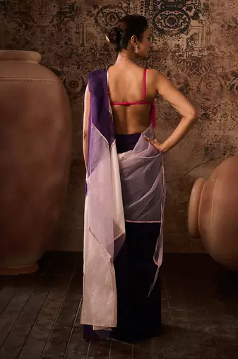 Hot pink blouse with multicoloured saree